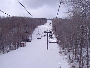 riding the ego alley lift looking up the trail
